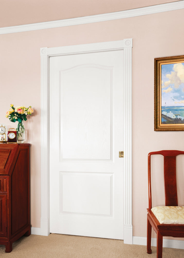 White Camden door in a room with a wooden desk, chair, and painting on the wall.