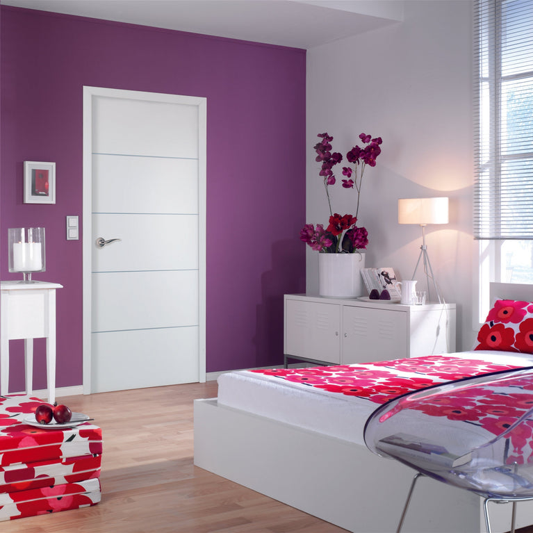 Modern bedroom with white door, purple walls, floral bedding, and a clear chair.
