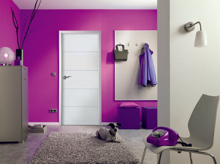 Modern interior with purple walls, a white door, and a gray rug.