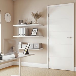 Modern home office with white door in the middle, desk, shelves, and decorative elements.