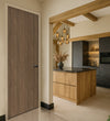 Natural Carini Walnut Egger laminate door in a modern kitchen interior